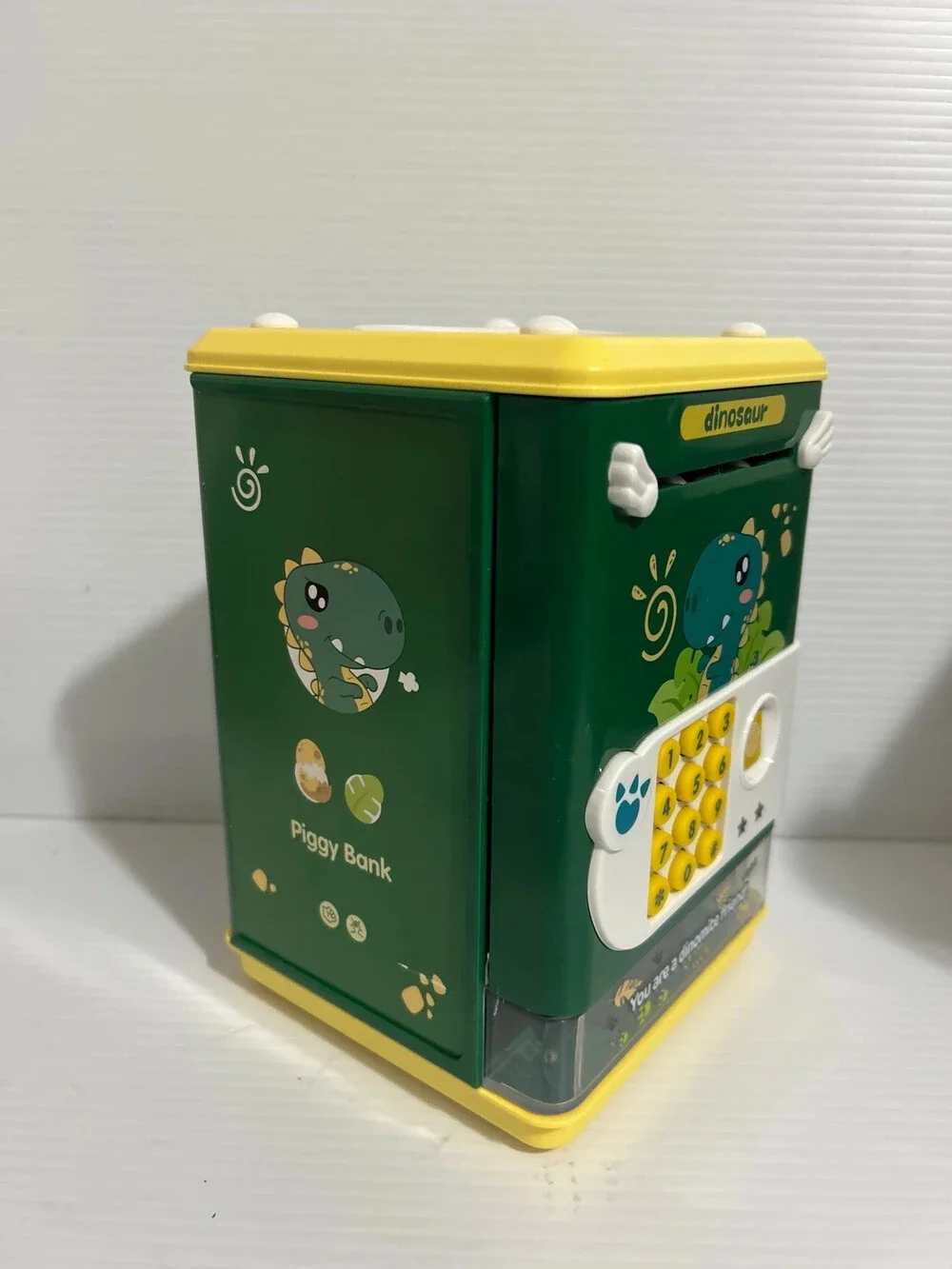 Título  Dinosaur Electronic Piggy Bank Password Safe Coin & Cash Saving Box for